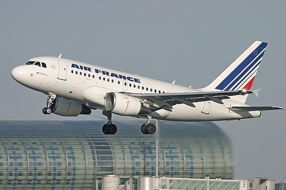White plane taking off