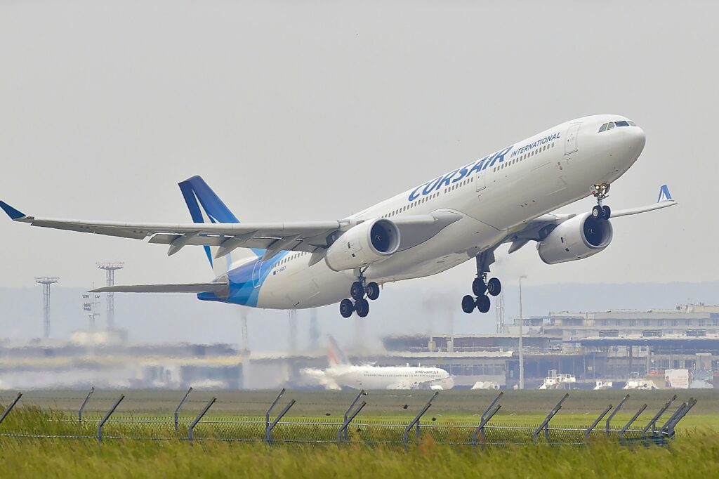 white and blue plane in the air