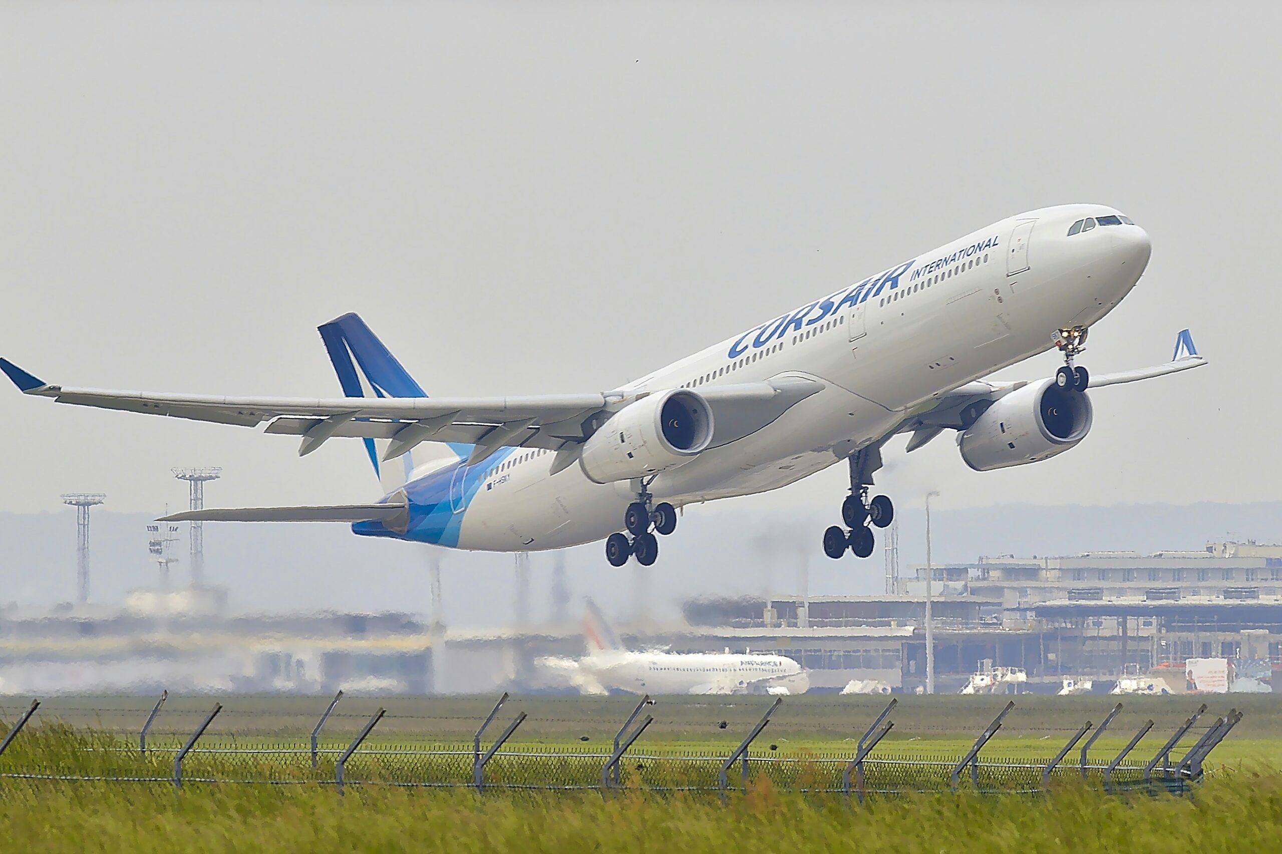 white and blue plane in the air