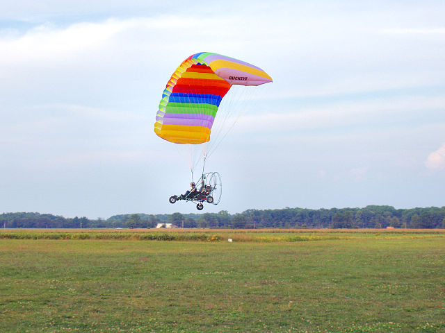 plane with colored parachute