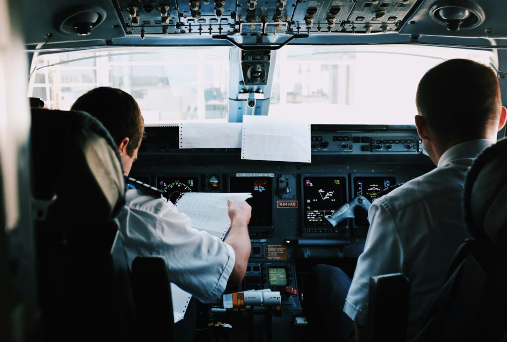 two men in airplane cockpit