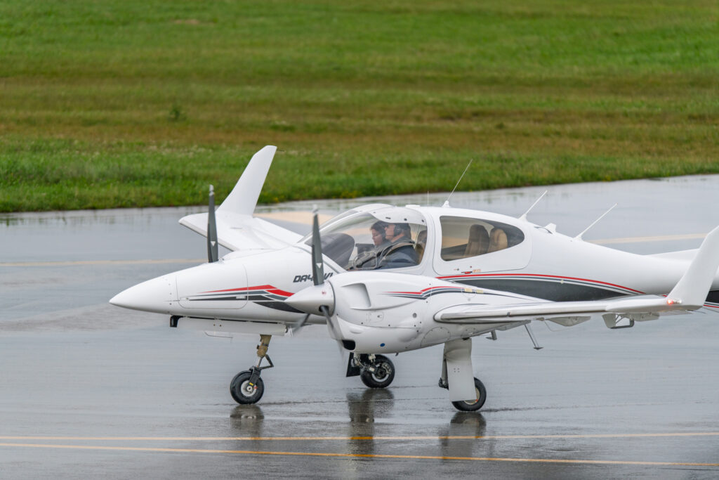 white plane on tarmack