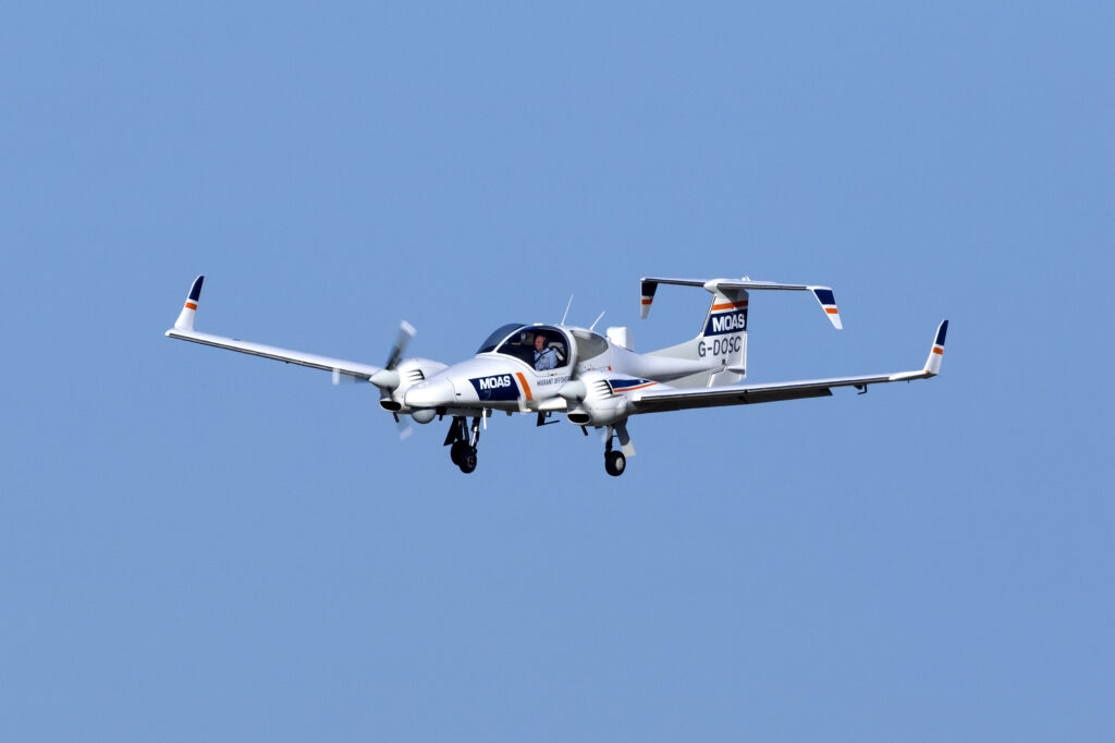 white plane with blue background